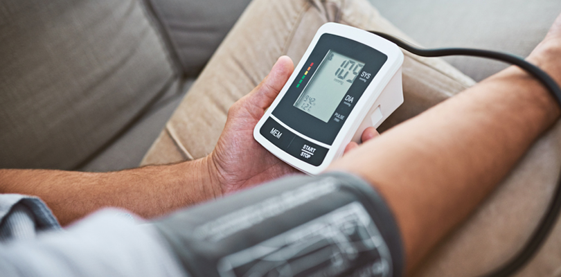 Person using blood pressure monitor