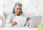 Senior woman reviews medical record information