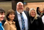 Retiring board member Rob Feckner (center) stands outside the recently named Feckner Auditorium with (from left) current team member SalliAnne Maliguine and former team members Mary Ann Burford, Esther Marcroft, and Ken Marzion.