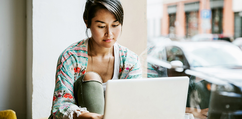 Woman using laptop indoors