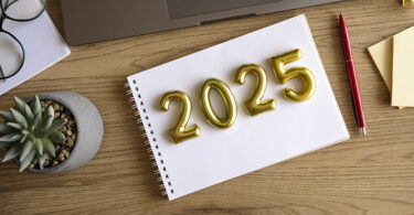 The number "2025" on top of a notepad