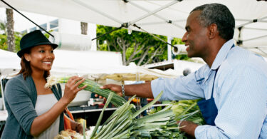 Man buying produce at a farmers market