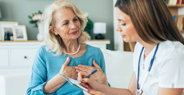 Senior woman listening to female doctor