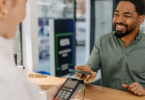 Man using phone to pay at the pharmacist