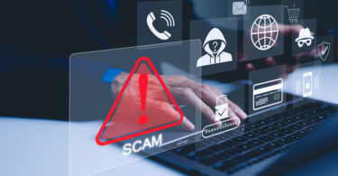 Person using laptop with graphics of warning symbols overlaid on top