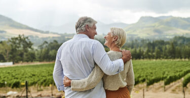 Elderly couple smiling to each other