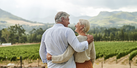 Elderly couple smiling to each other