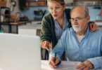 Senior couple looking at laptop computer together