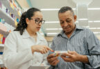 Pharmacist explaining a medication to a customer