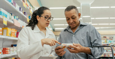 Pharmacist explaining a medication to a customer